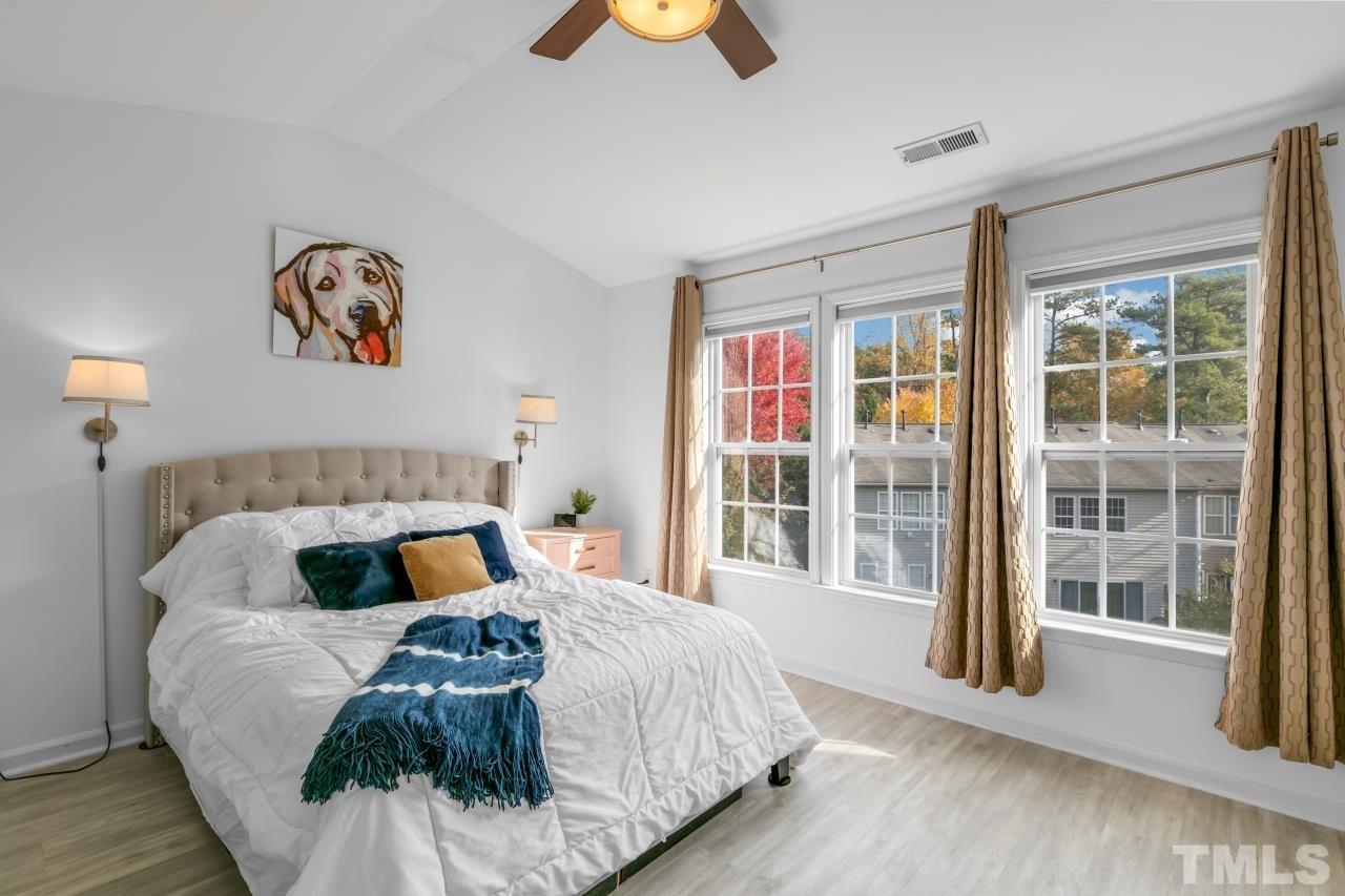 7106 Proctor Hill Drive Raleigh, NC 27613 - Photo 19 of 29 a bedroom with a bed and a large window