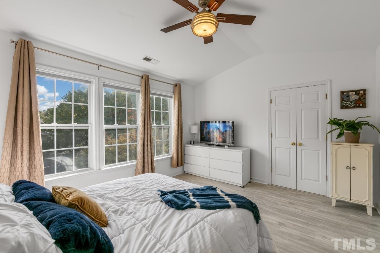 7106 Proctor Hill Drive Raleigh, NC 27613 - Photo 20 of 29 a bedroom with a bed and a window