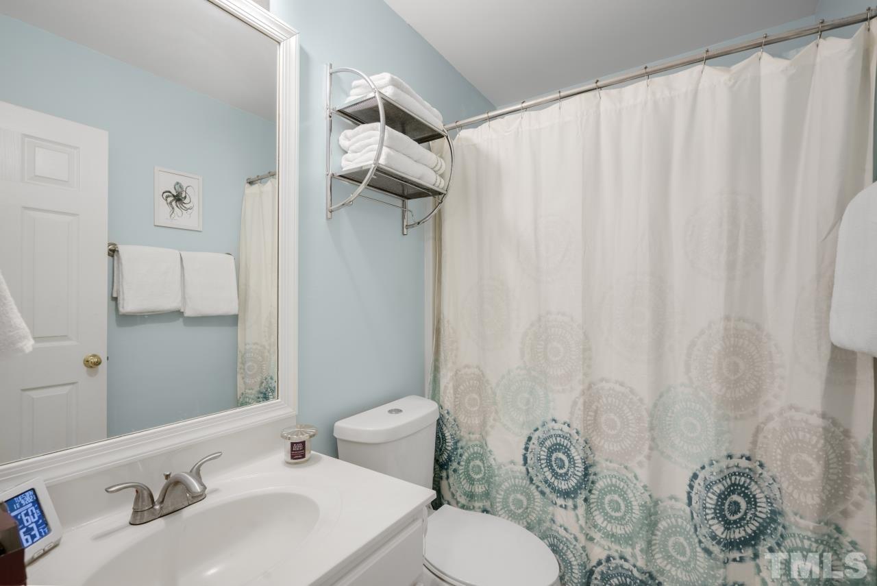 7106 Proctor Hill Drive Raleigh, NC 27613 - Photo 24 of 29 a bathroom with a sink toilet and shower