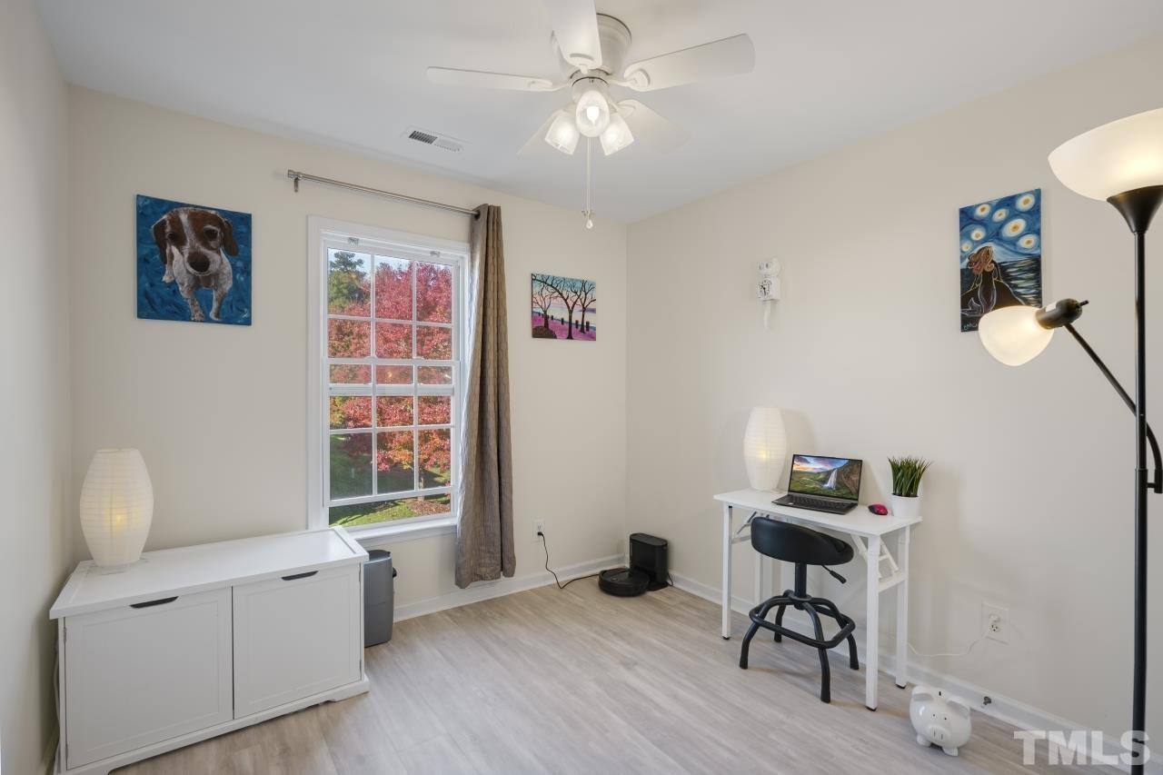 7106 Proctor Hill Drive Raleigh, NC 27613 - Photo 25 of 29 a living room with furniture and a window