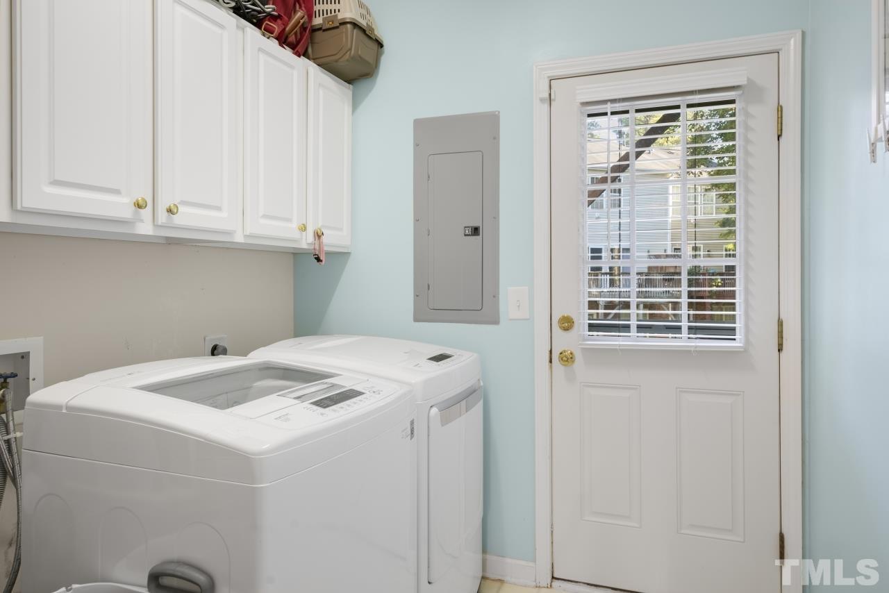 7106 Proctor Hill Drive Raleigh, NC 27613 - Photo 26 of 29 a utility room with dryer and washer