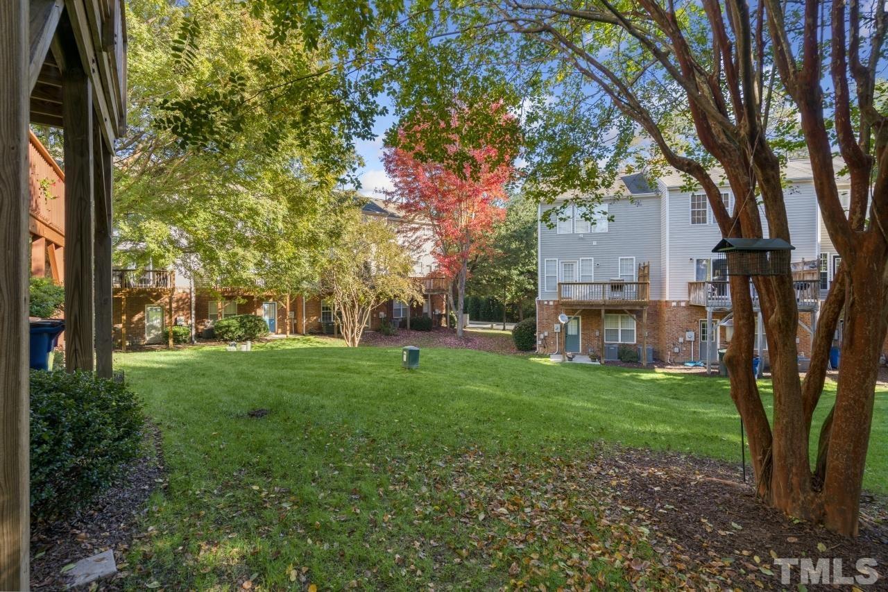 7106 Proctor Hill Drive Raleigh, NC 27613 - Photo 28 of 29 a view of a trees in front of a house