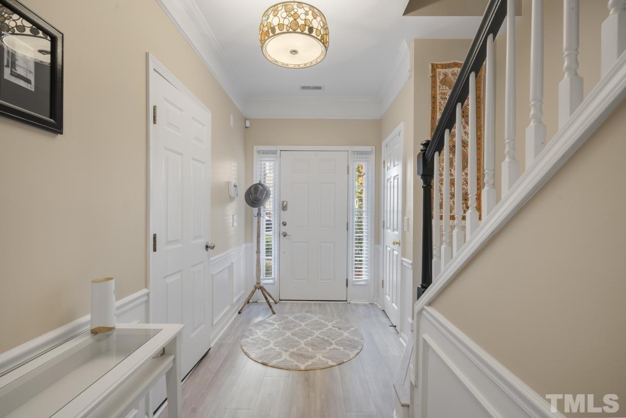 7106 Proctor Hill Drive Raleigh, NC 27613 - Photo 3 of 29 a bathroom with a granite countertop sink a mirror and a bathtub