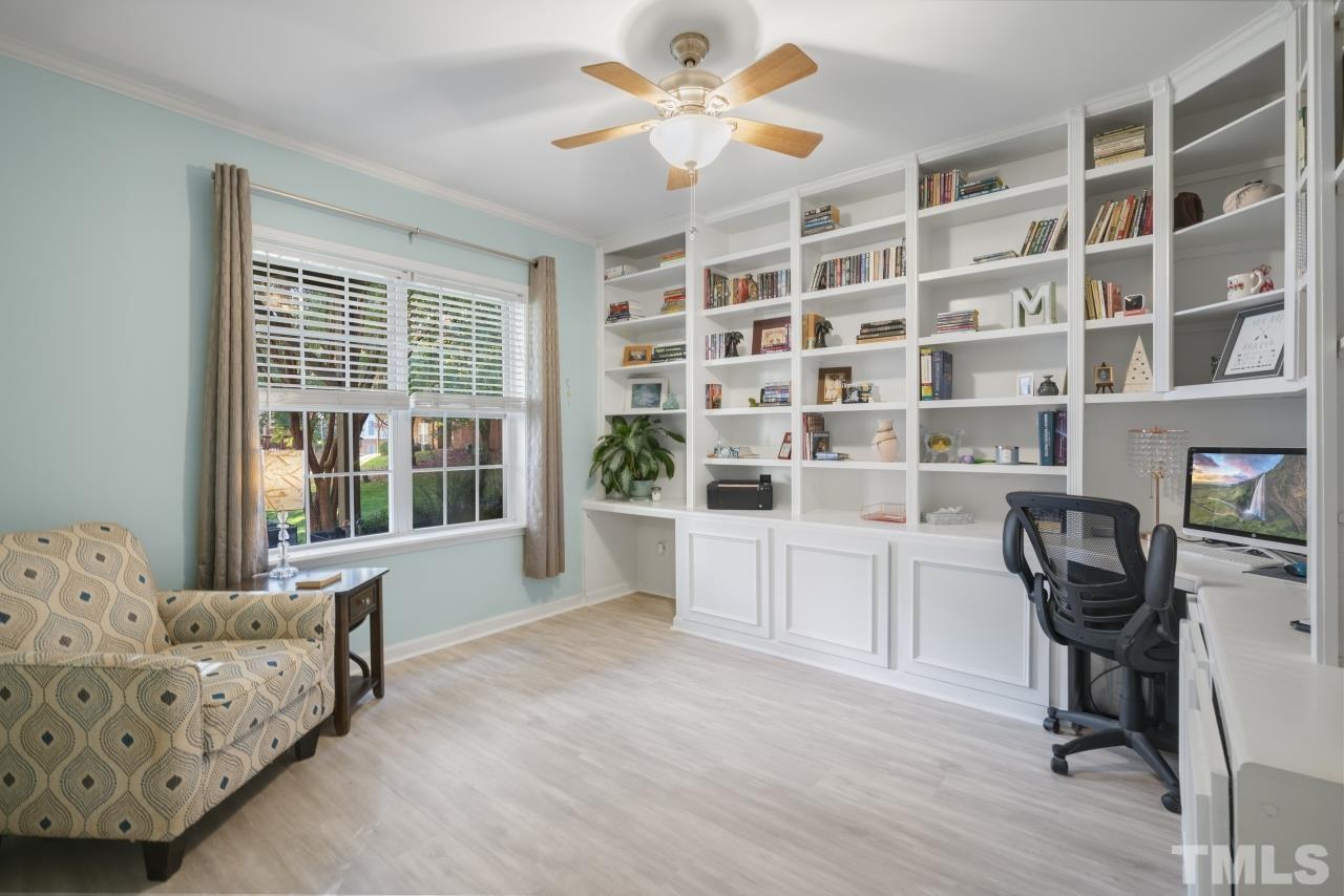 7106 Proctor Hill Drive Raleigh, NC 27613 - Photo 4 of 29 a living room with furniture and a large window with wooden floor