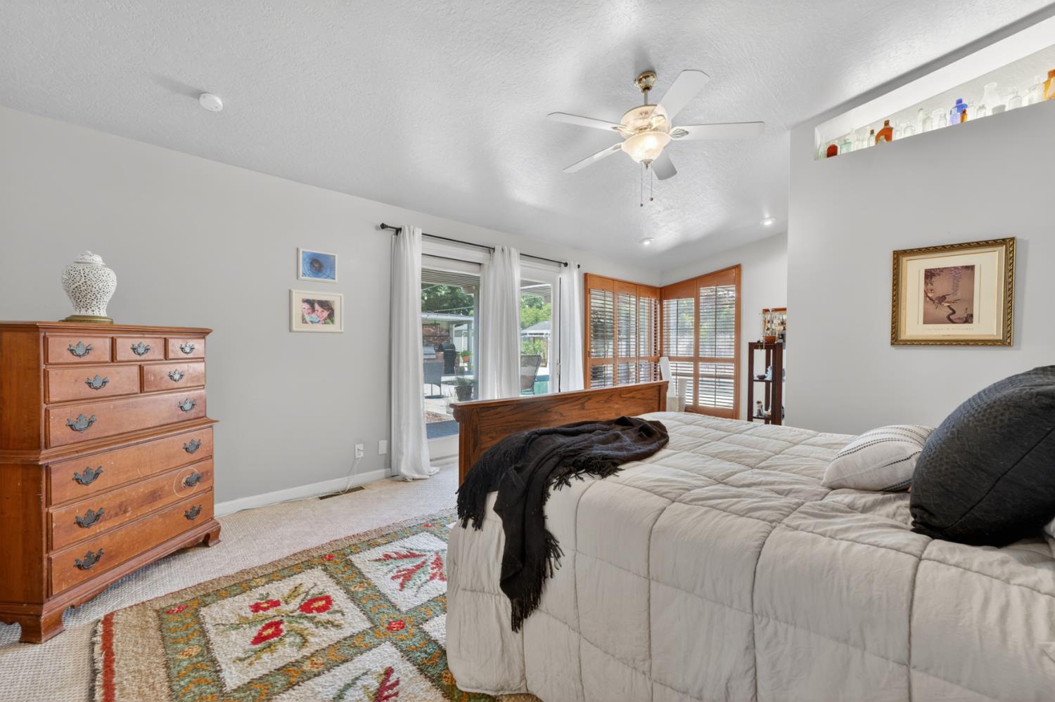 1880 Magnolia Street Gridley, CA 95948 - Photo 33 of 95 a bedroom with a large bed and a chandelier