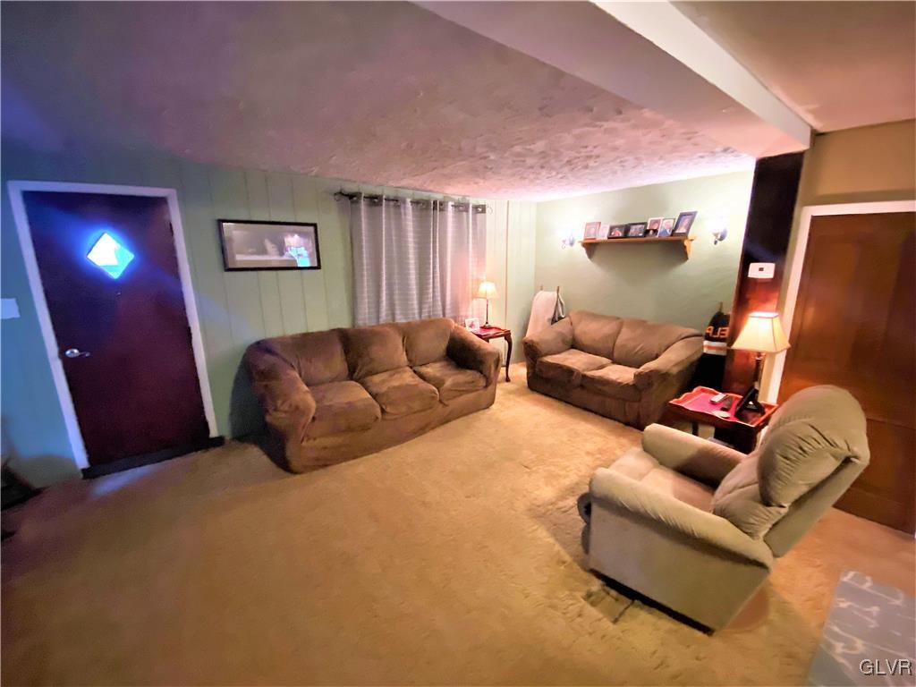 2102 Nemeth Drive Bethlehem, PA 18015 - Photo 24 of 33 a living room with furniture and a flat screen tv