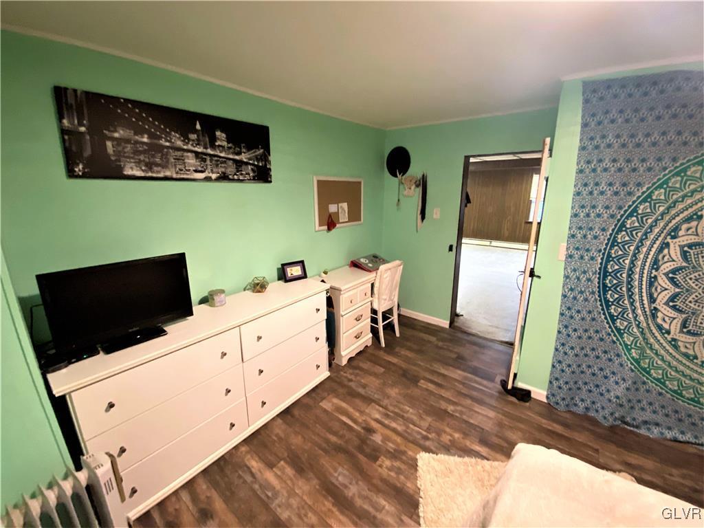 2102 Nemeth Drive Bethlehem, PA 18015 - Photo 30 of 33 a room with furniture a flat screen tv and a fireplace