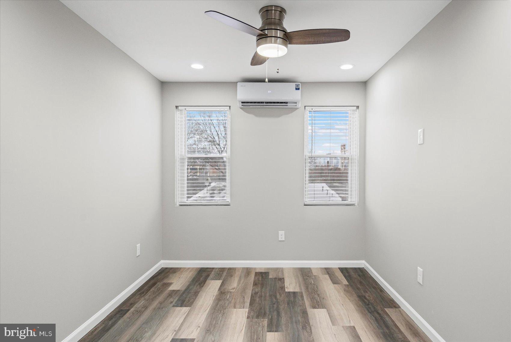 407 Pitman Place Baltimore, MD 21202 - Photo 20 of 42 wooden floor in an empty room with a window