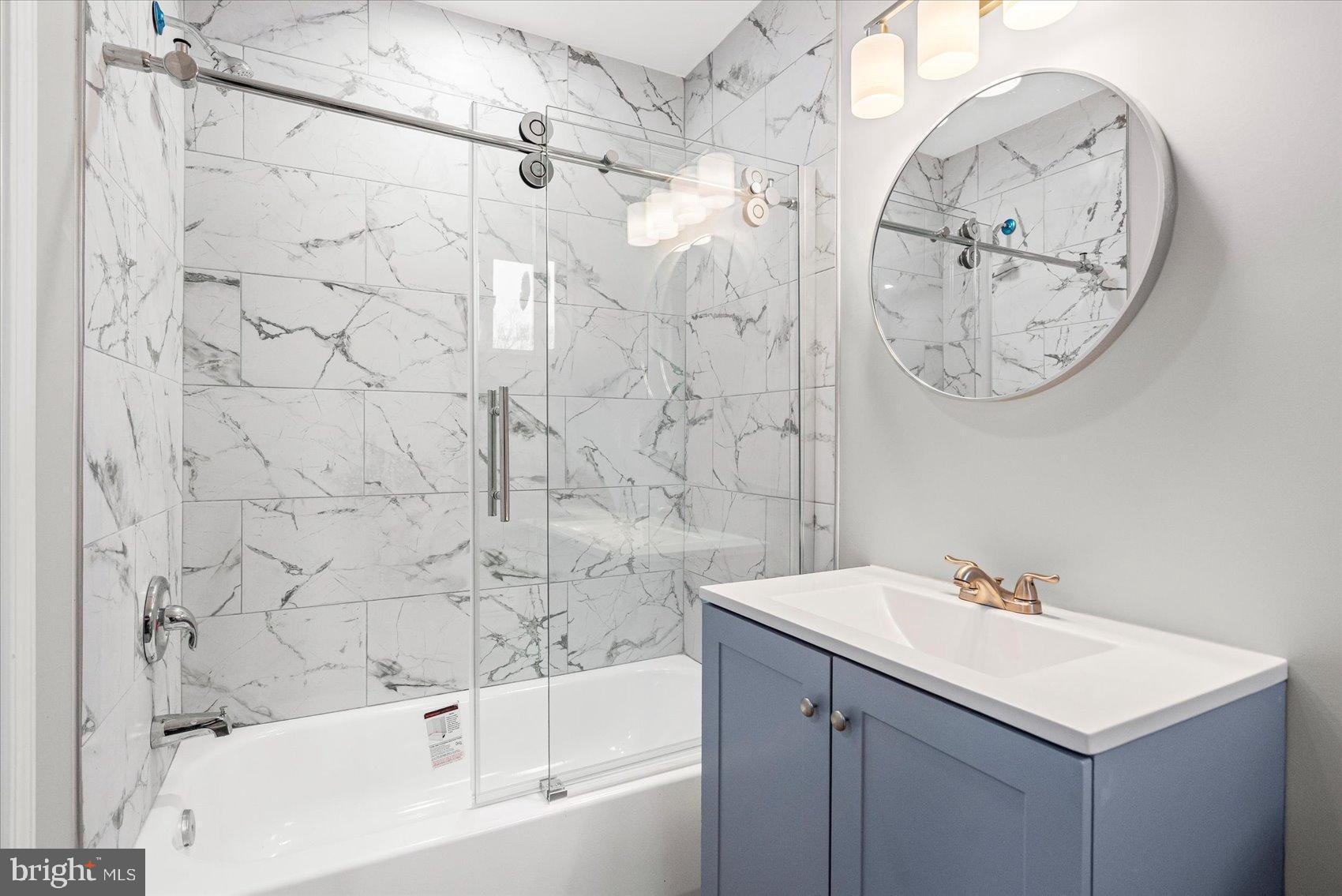 407 Pitman Place Baltimore, MD 21202 - Photo 22 of 42 a bathroom with a sink and a mirror
