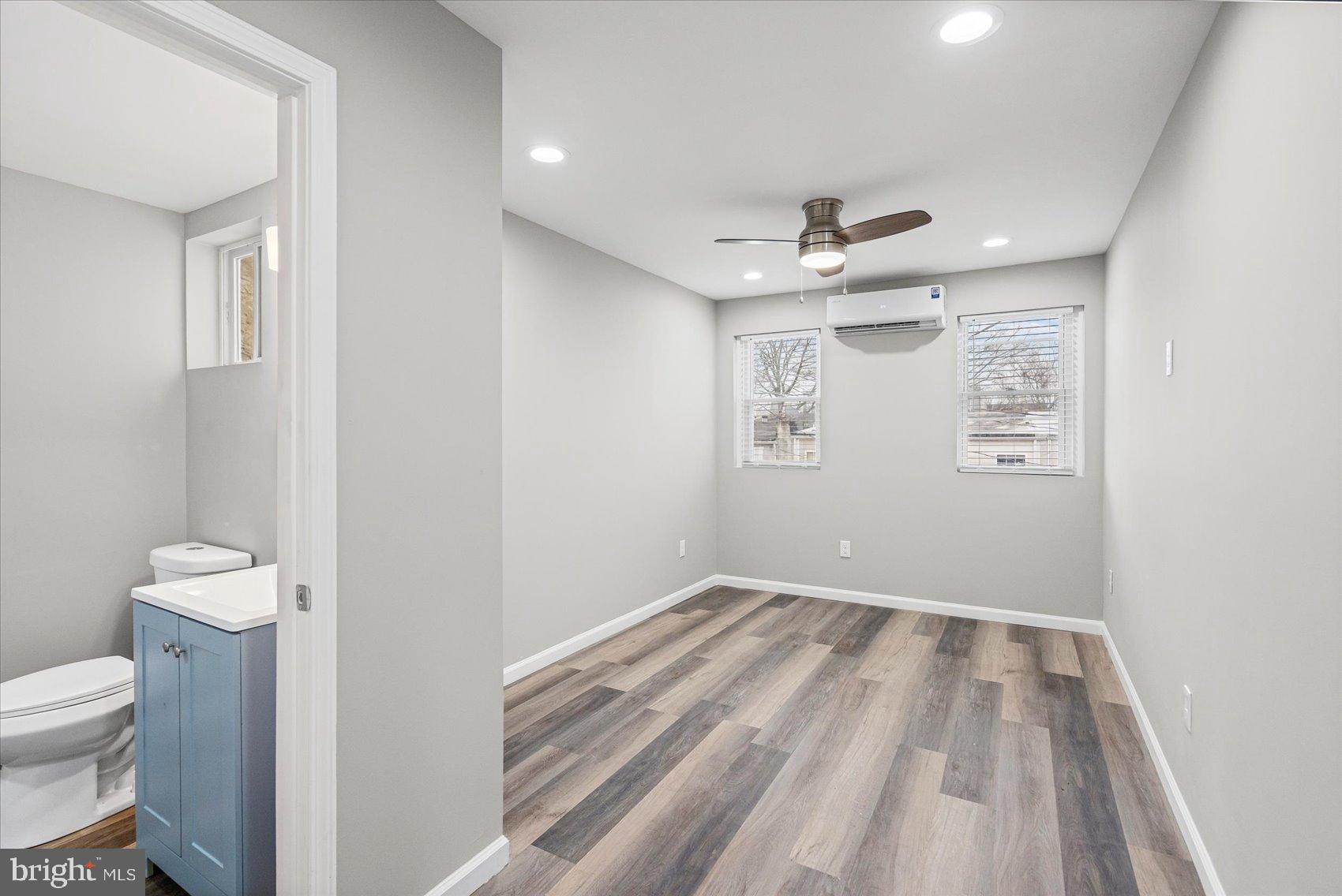 407 Pitman Place Baltimore, MD 21202 - Photo 24 of 42 a bathroom with a toilet sink and shower