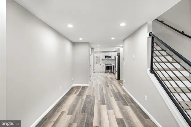 a view of gallery with wooden floor