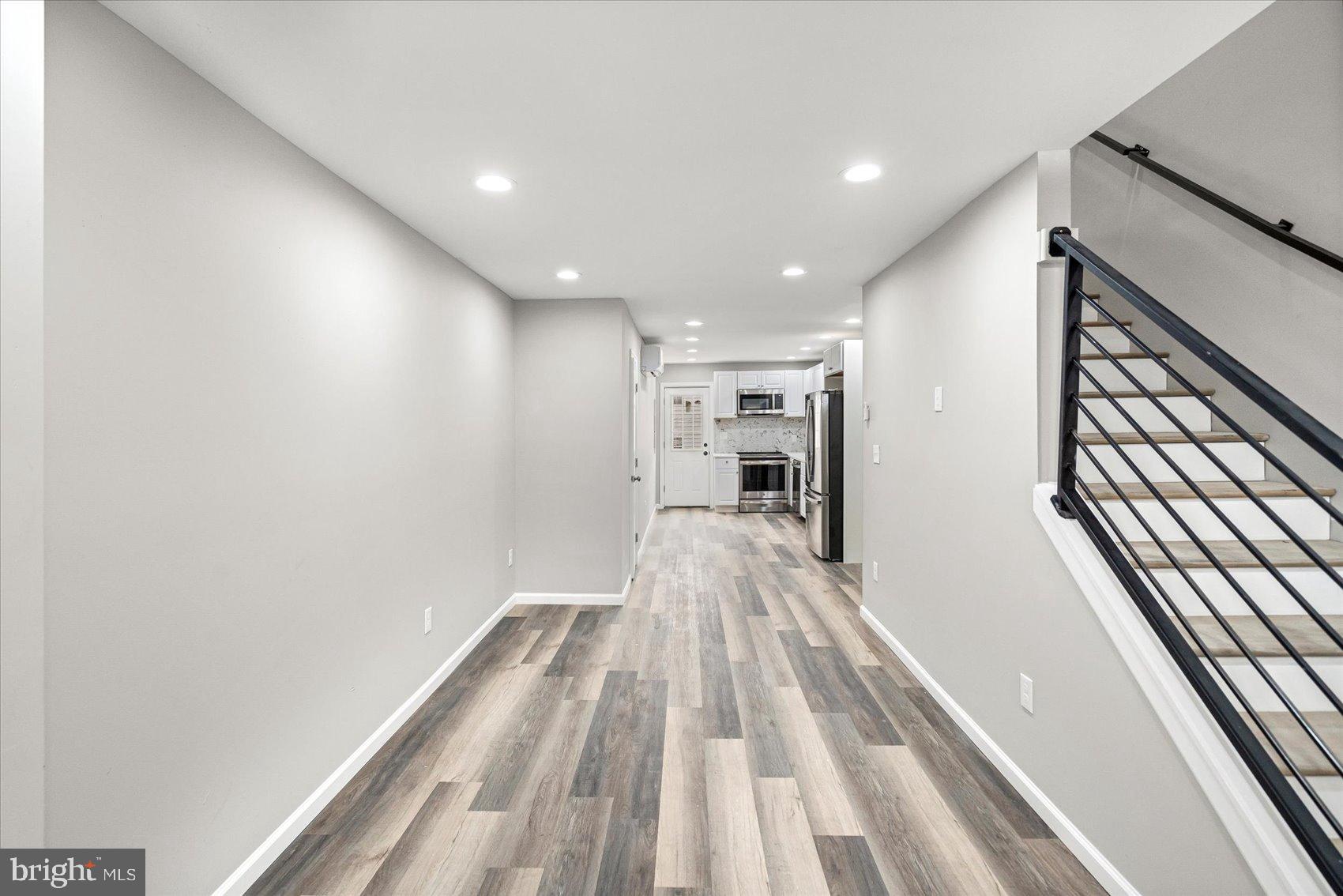 407 Pitman Place Baltimore, MD 21202 - Photo 3 of 42 a view of gallery with wooden floor