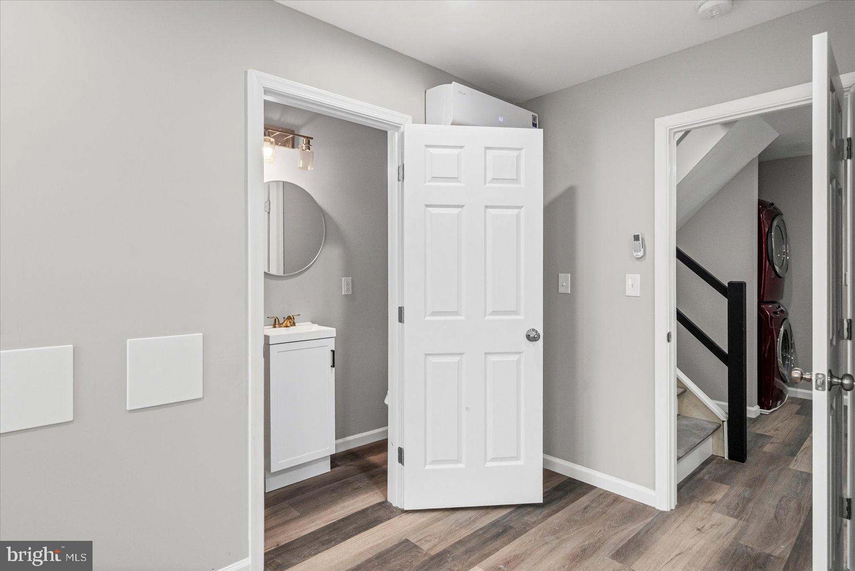 407 Pitman Place Baltimore, MD 21202 - Photo 31 of 42 a view of hallway with wooden floor
