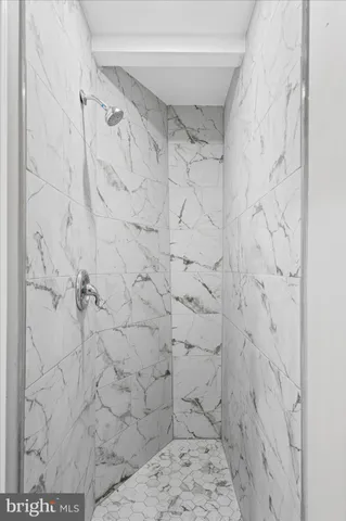 a view of a house with wooden fence