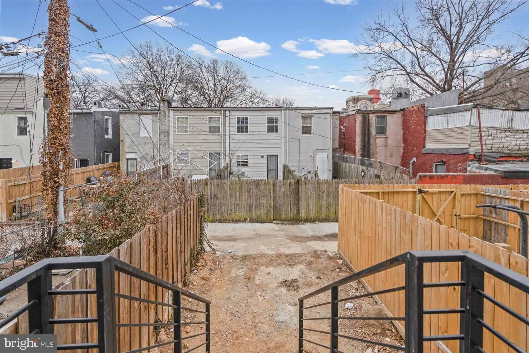 407 Pitman Place Baltimore, MD 21202 - Photo 35 of 42 a view of a house with a wooden fence