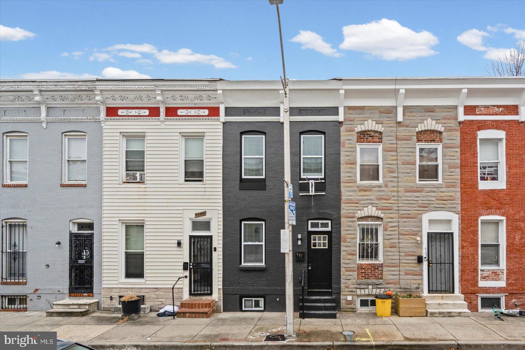 407 Pitman Place Baltimore, MD 21202 - Photo 37 of 42 a front view of a building with glass windows