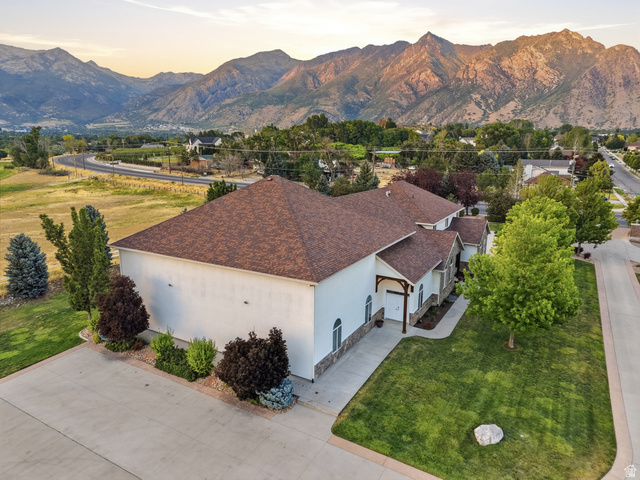 702 Alpine Highway Alpine, UT 84004 - Photo 7 of 83 Expansive property featuring a large concrete driveway, mature landscaping, and a brown shingle roof