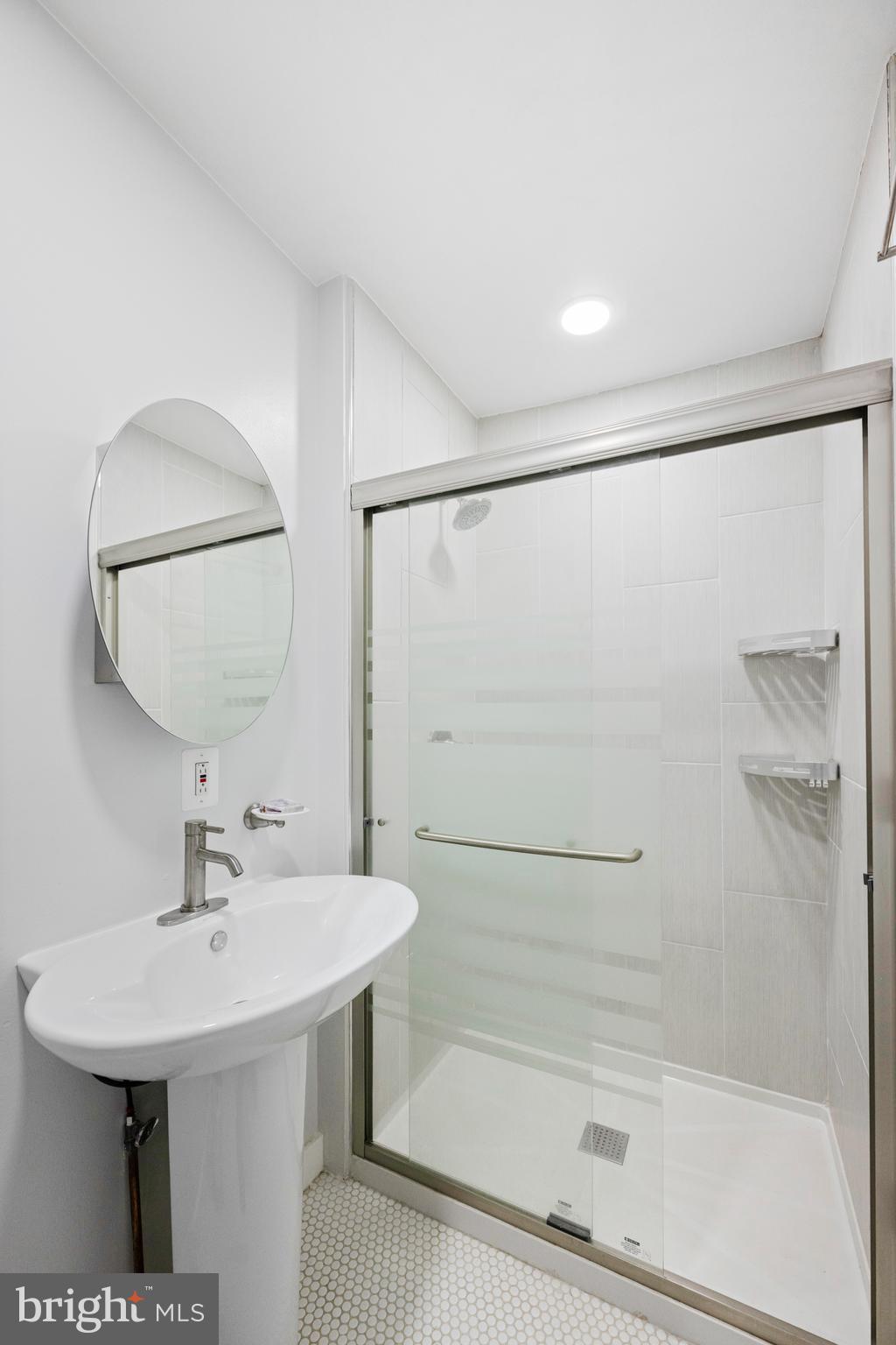 116 Marshall Road Lansdowne, PA 19050 - Photo 23 of 40 a bathroom with a sink a shower and a mirror