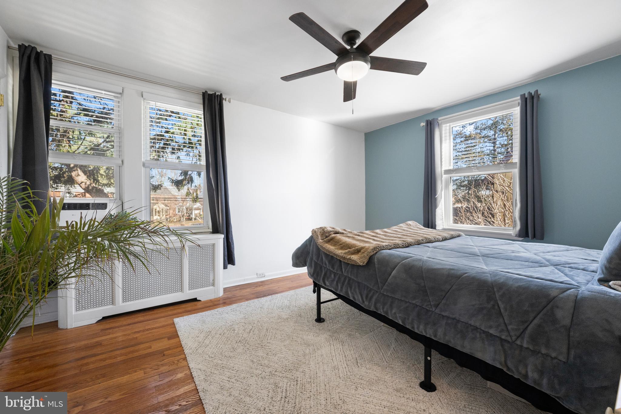 116 Marshall Road Lansdowne, PA 19050 - Photo 24 of 40 a bedroom with a large bed and a large window