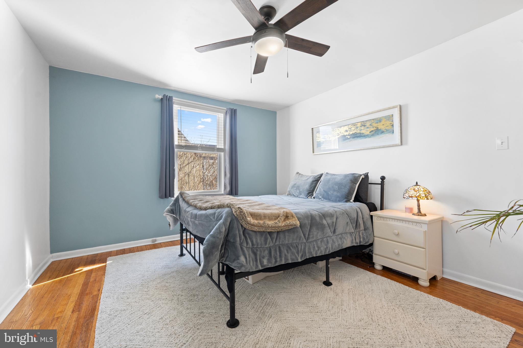 116 Marshall Road Lansdowne, PA 19050 - Photo 25 of 40 a bedroom with a bed and a chandelier