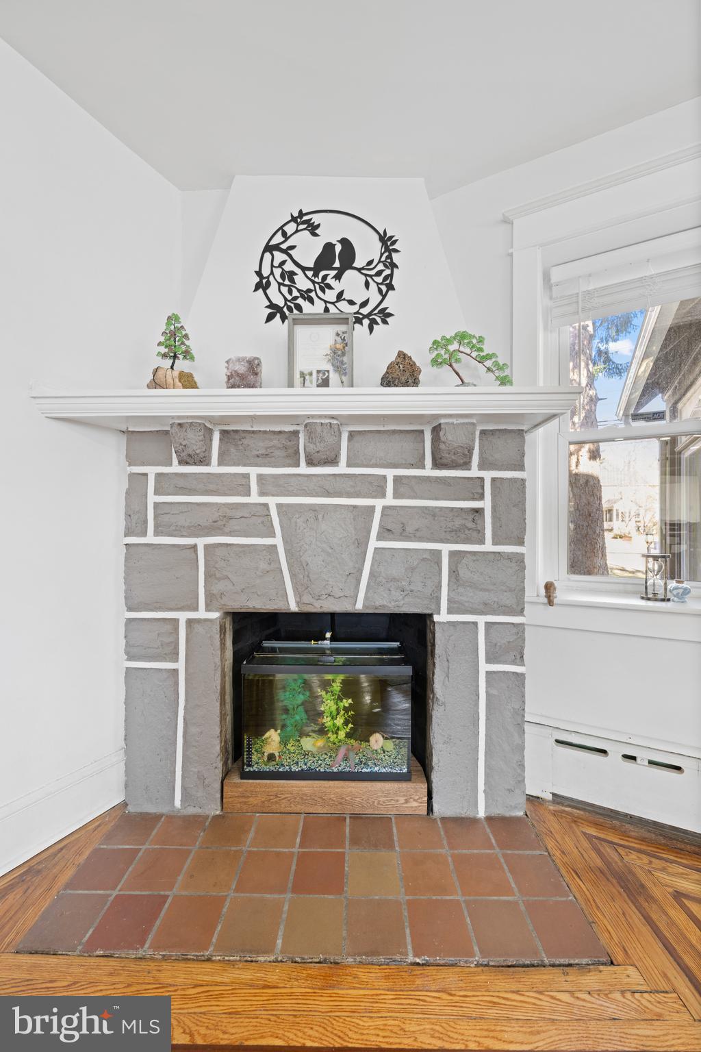 116 Marshall Road Lansdowne, PA 19050 - Photo 9 of 40 a living room with a fireplace cabinet and a fireplace