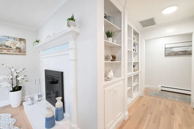 a bedroom with two beds and a window