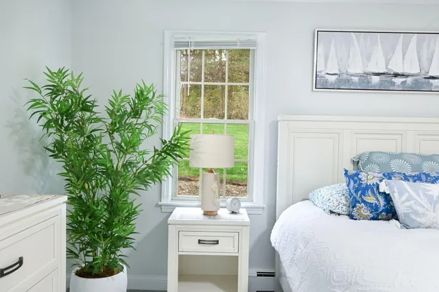 a view of a house with backyard porch and sitting area