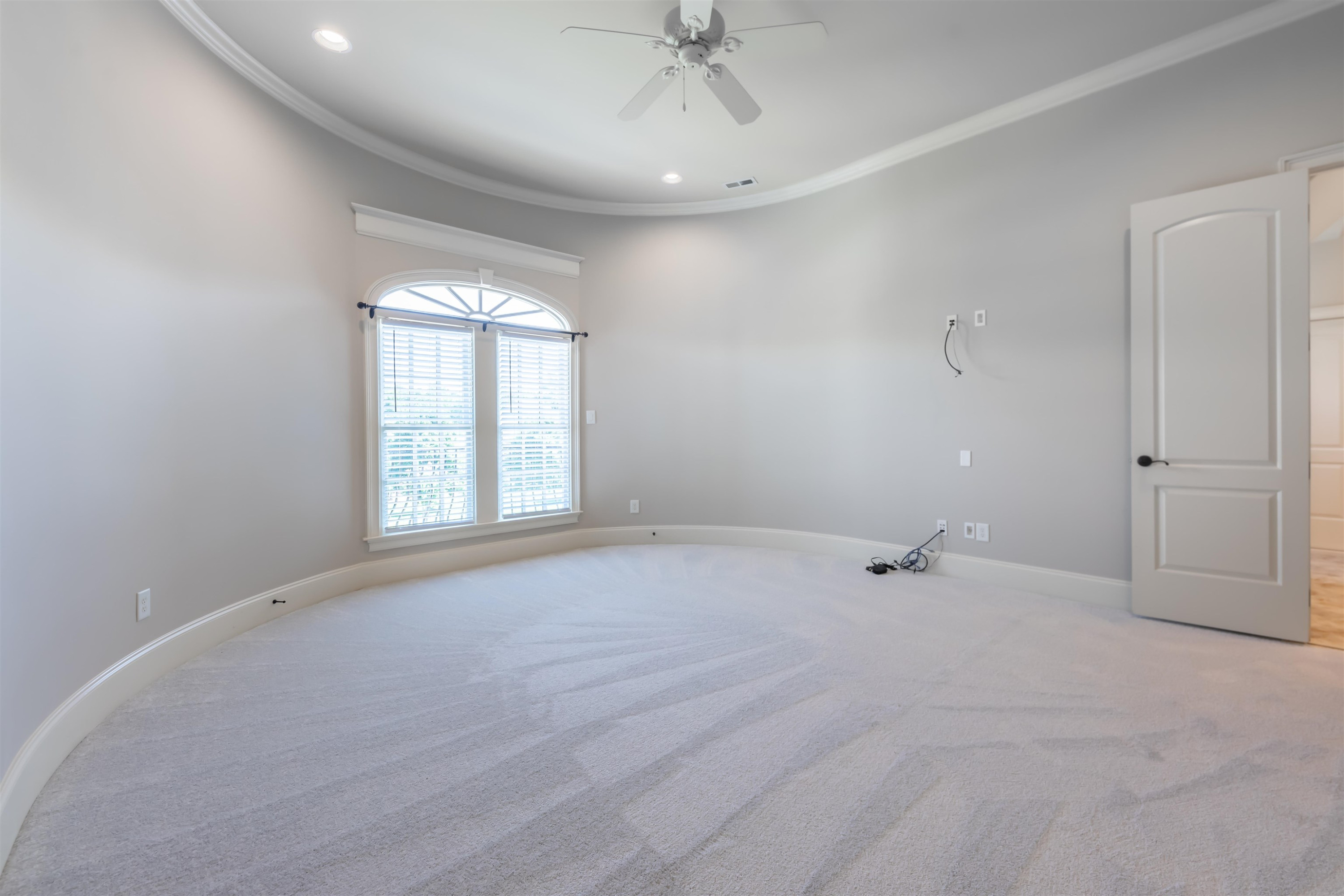 9805 Najma Street Raleigh, NC 27613 - Photo 23 of 30 The secondary bedrooms are really large. This front bedroom sits above the dining room and follows the curved wall of the turret. High ceilings, crown molding, new carpet. It has a large walk in closet and private bath. Bedroom
