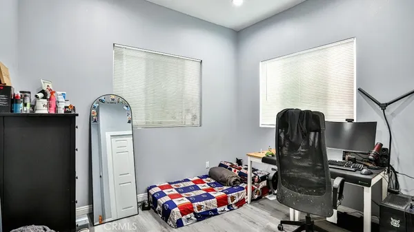 a bedroom with furniture and a window