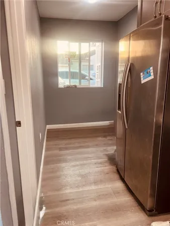 a view of wooden floor and windows in a room