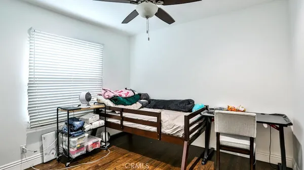 a reading room with furniture and a window
