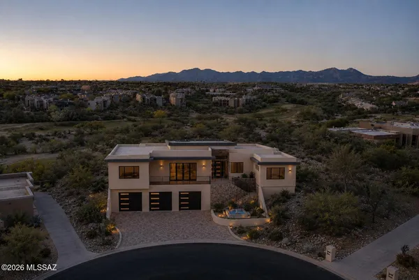 an aerial view of house with mountain view