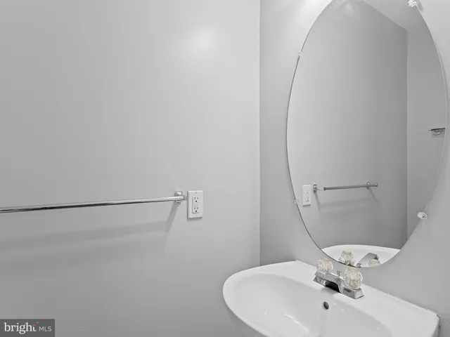 a bathroom with a sink and shower