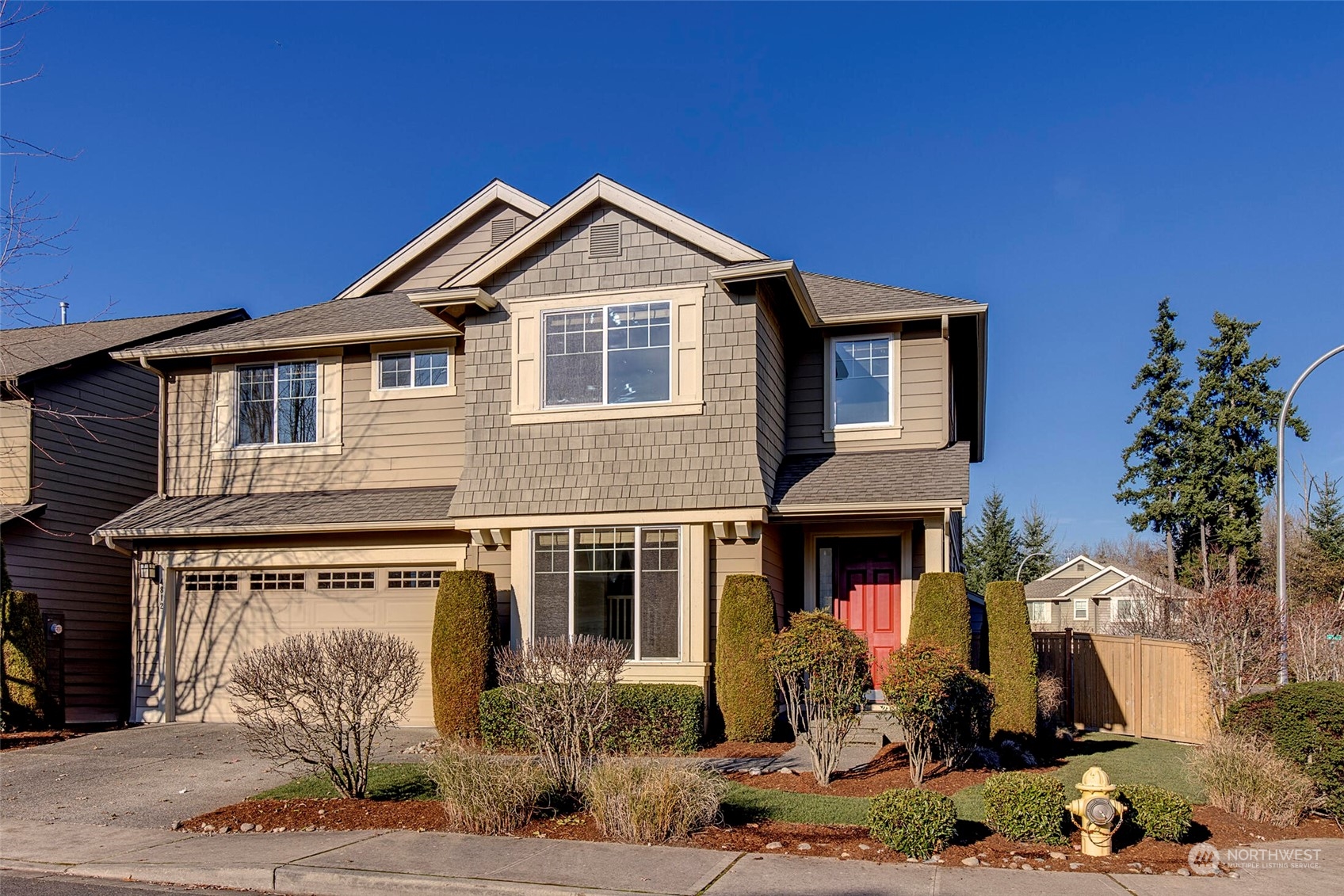 4812 Northeast 2nd Place Renton, WA 98059 - Photo 1 of 26 a front view of a house with a yard