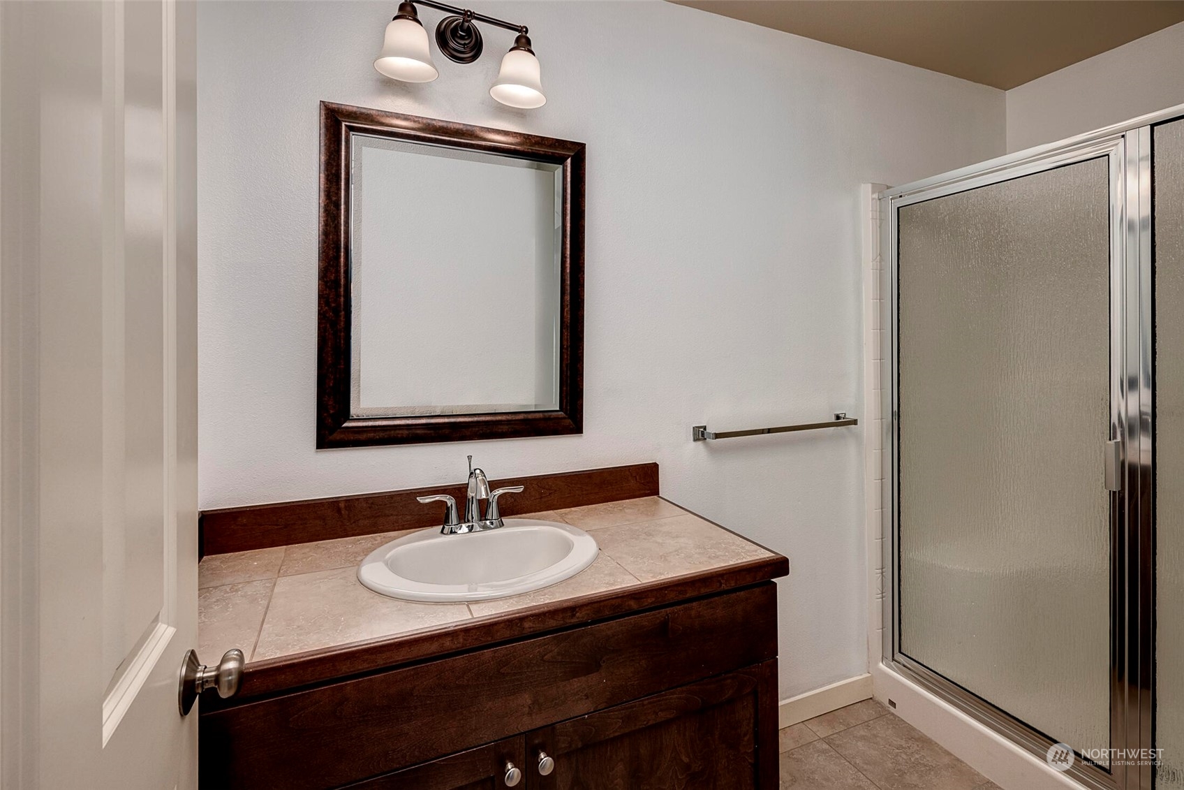 4812 Northeast 2nd Place Renton, WA 98059 - Photo 14 of 26 a bathroom with a sink and a mirror