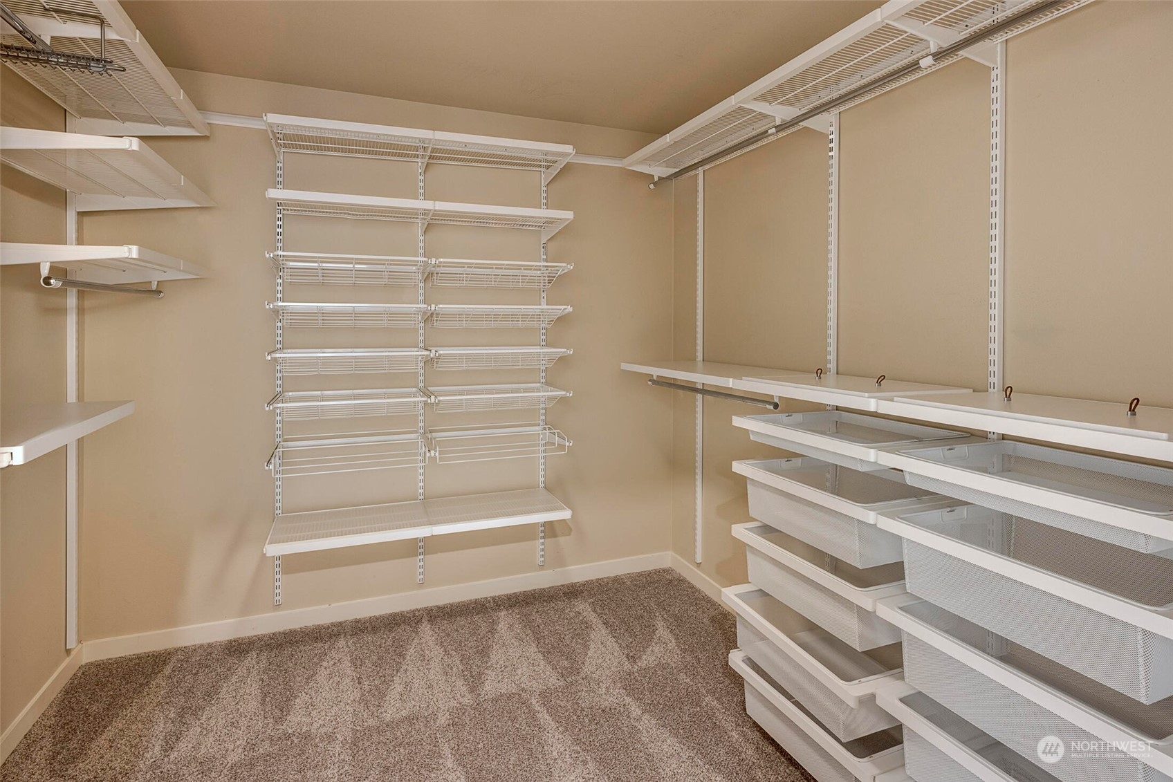 4812 Northeast 2nd Place Renton, WA 98059 - Photo 18 of 26 a view of walk in closet with empty racks