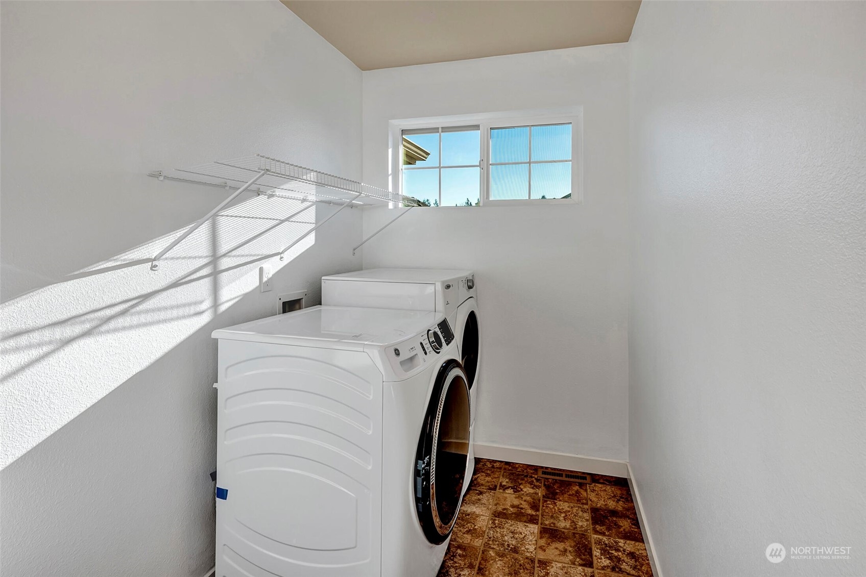 4812 Northeast 2nd Place Renton, WA 98059 - Photo 24 of 26 a utility room with dryer and washer