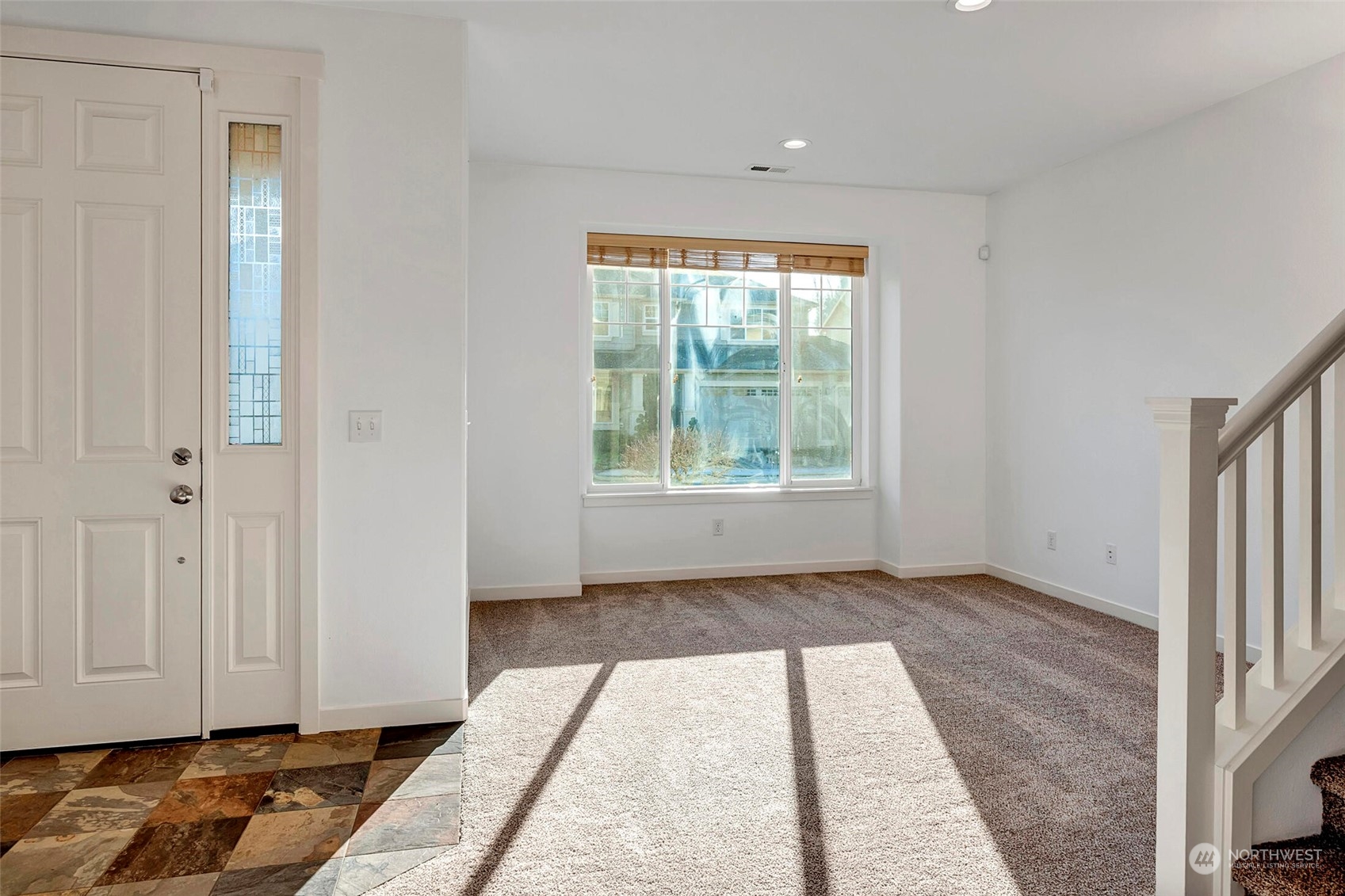 4812 Northeast 2nd Place Renton, WA 98059 - Photo 5 of 26 a view of hallway with window and a rug
