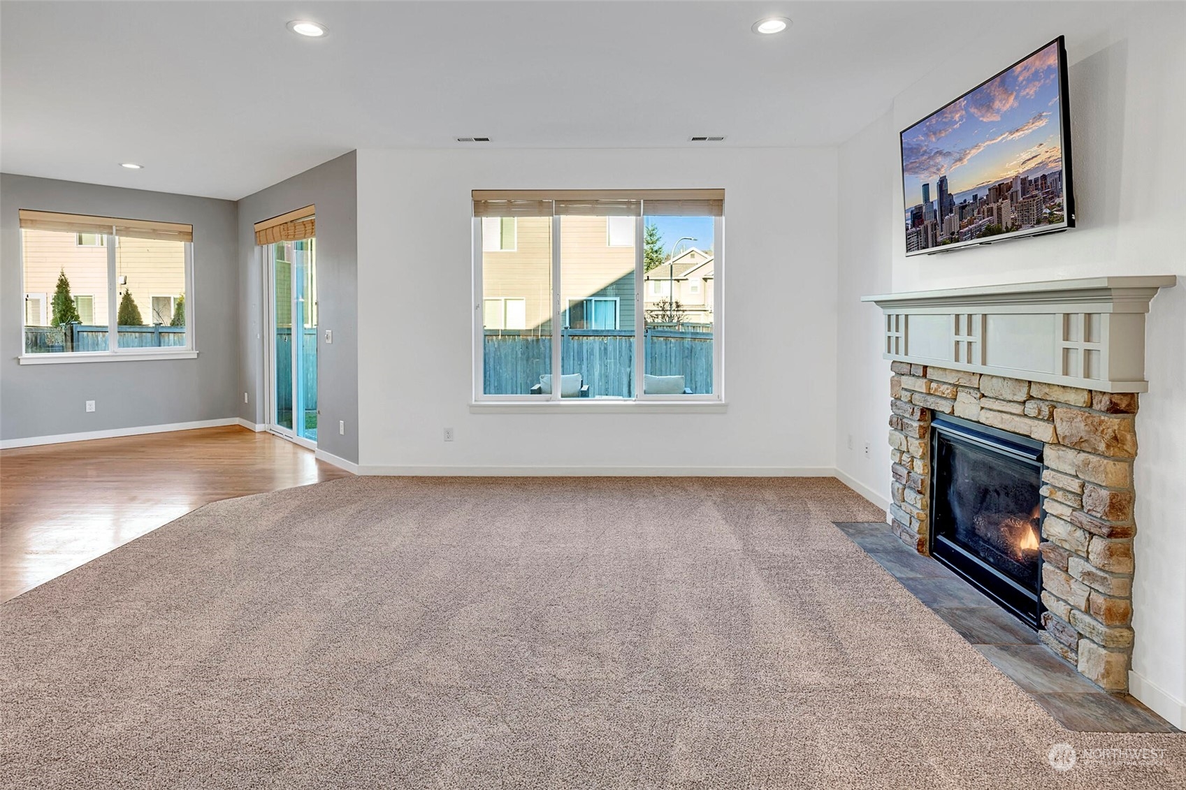 4812 Northeast 2nd Place Renton, WA 98059 - Photo 6 of 26 wooden floor fireplace and windows in an empty room