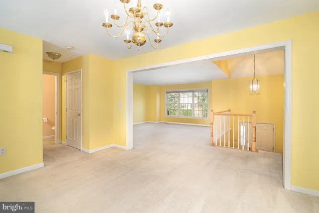 a view of an empty room with a fireplace