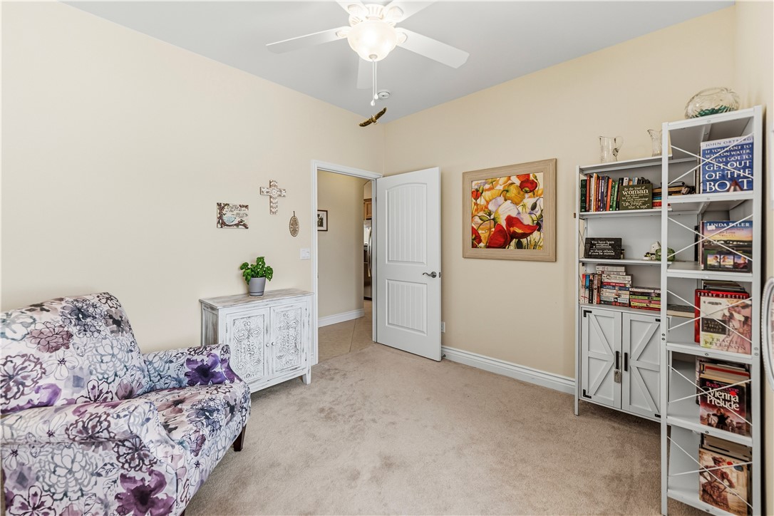3315 Rainbow Mine Road Kingman, AZ 86401 - Photo 32 of 54 This room features neutral-toned walls, carpeting, and a ceiling fan