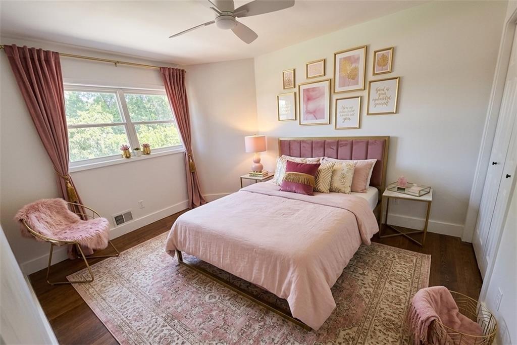 3763 Elkridge Drive Decatur, GA 30032 - Photo 14 of 20 a bedroom with a bed and wooden floor