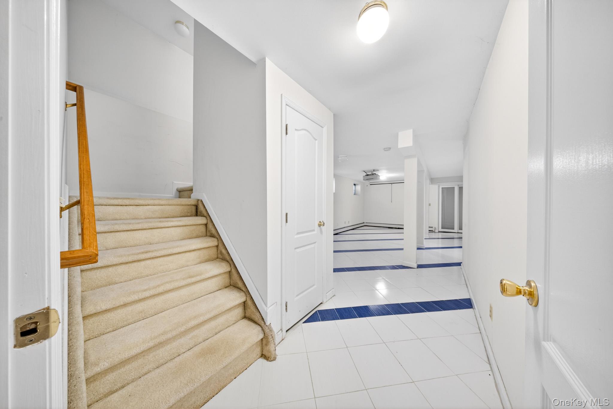 82 B Inwood Road Port Washington, NY 11050 - Photo 27 of 41 a view of entryway and hall with wooden floor