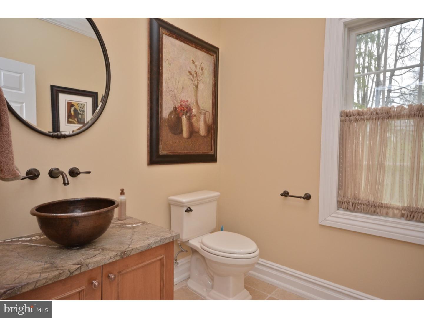 4571 Province Line Road Princeton, NJ 08540 - Photo 15 of 25 a bathroom with a toilet a sink and mirror