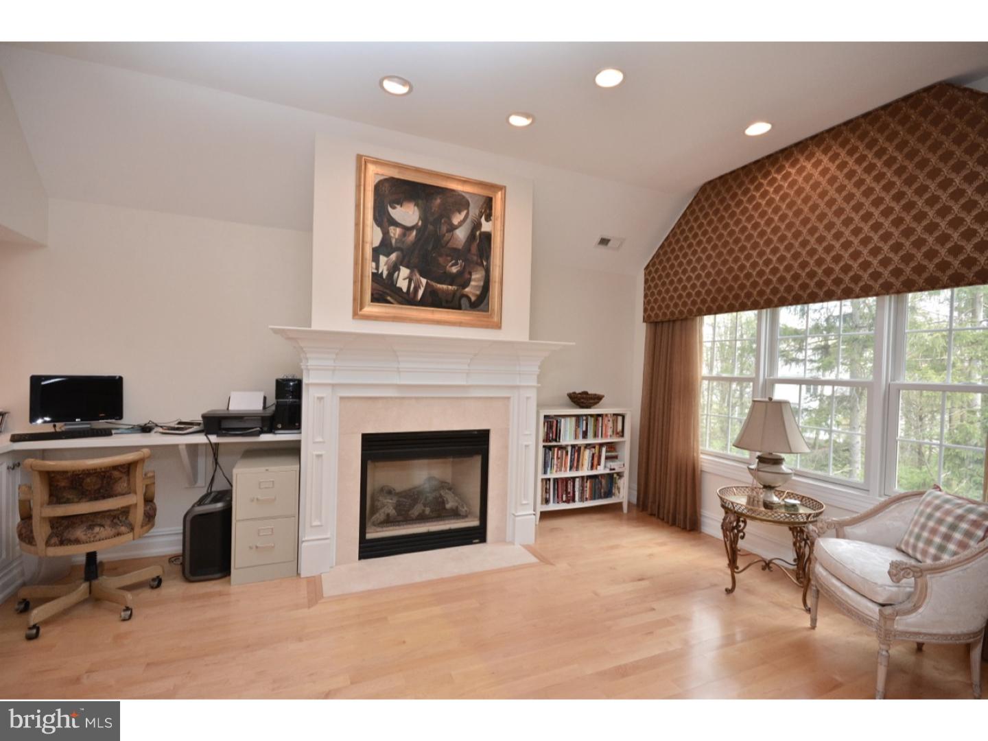4571 Province Line Road Princeton, NJ 08540 - Photo 17 of 25 a living room with furniture a fireplace and a flat screen tv