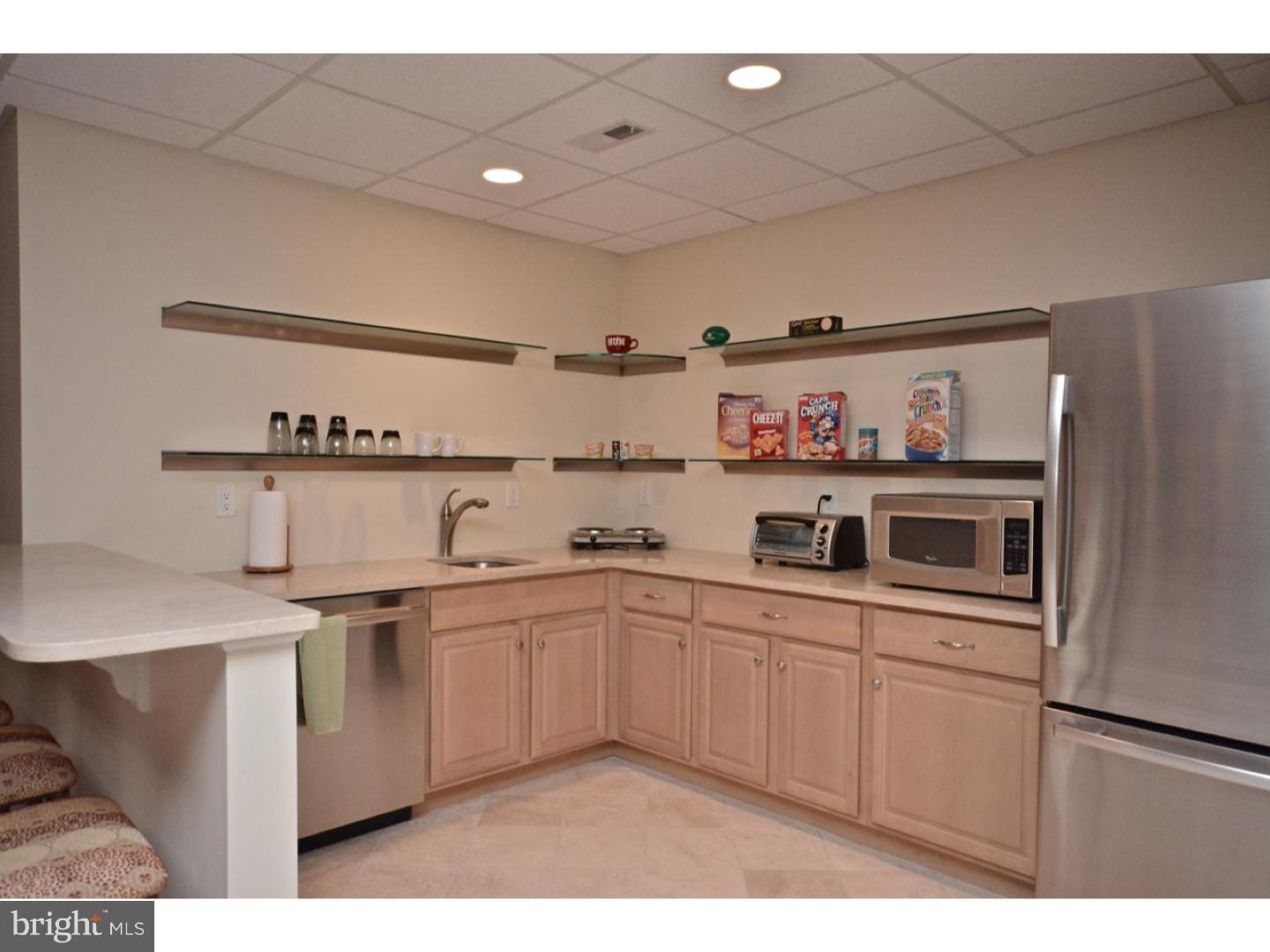 4571 Province Line Road Princeton, NJ 08540 - Photo 24 of 25 a kitchen with stainless steel appliances a sink and cabinets