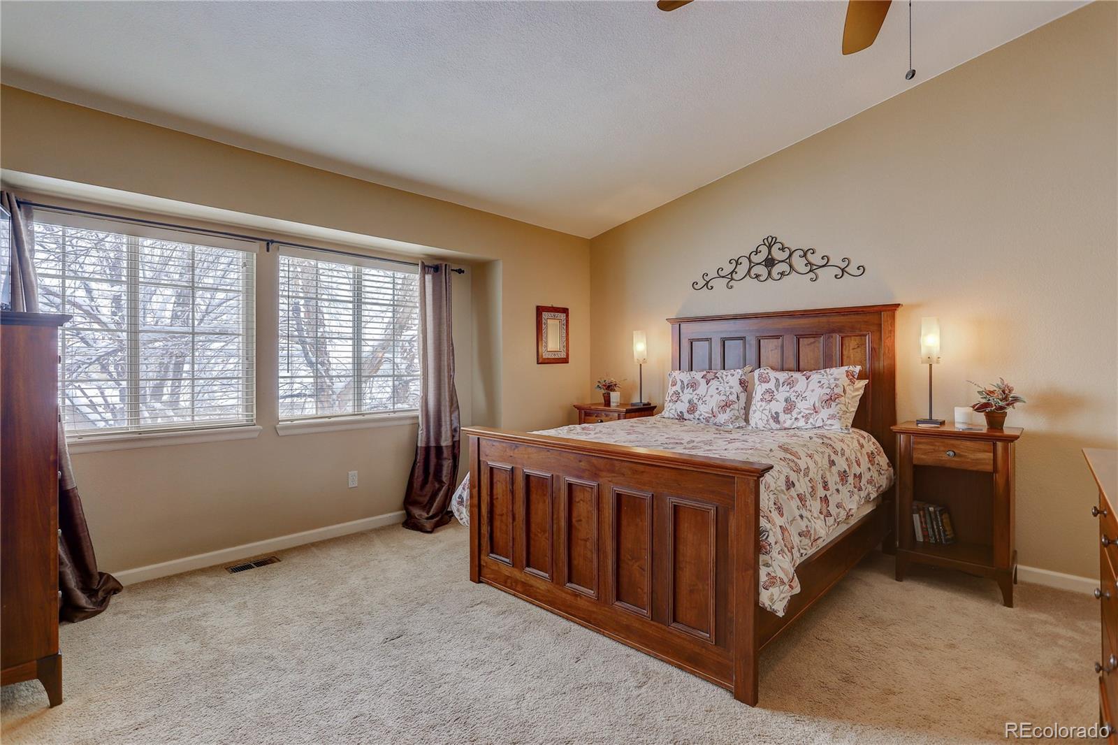 431 Mountain Chickadee Road Highlands Ranch, CO 80126 - Photo 17 of 38 a bedroom with a bed and a window