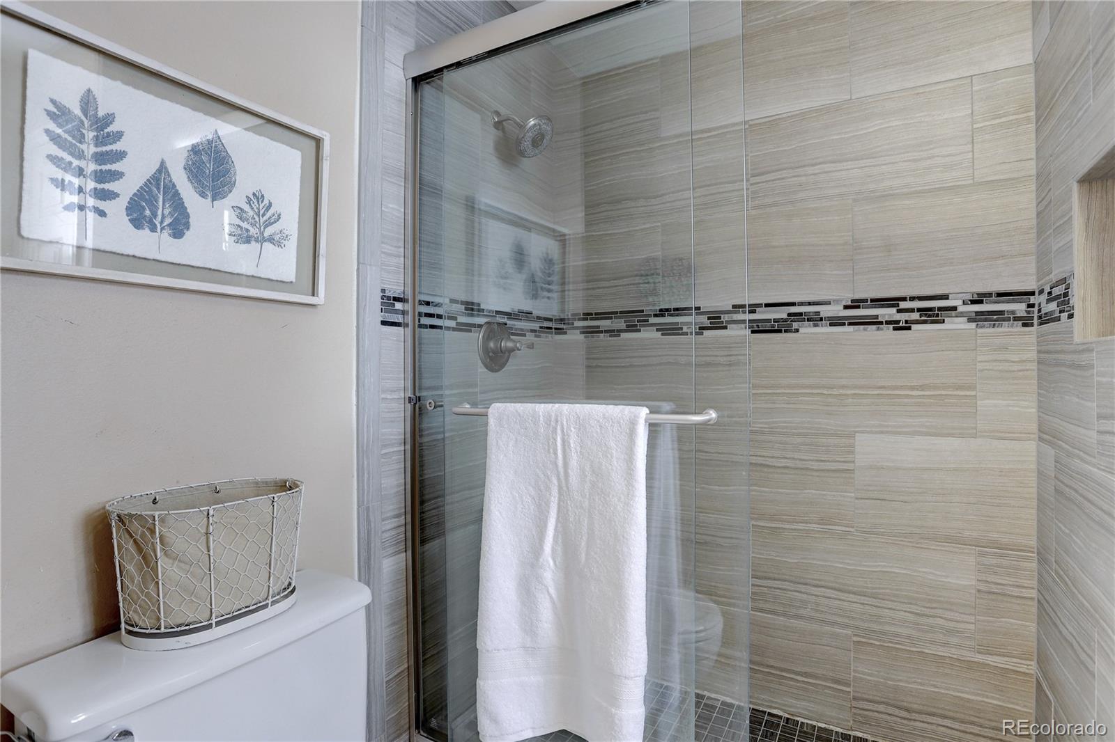 431 Mountain Chickadee Road Highlands Ranch, CO 80126 - Photo 20 of 38 a bathroom with a shower and a sink