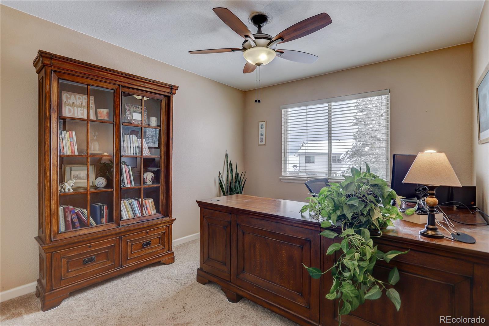 431 Mountain Chickadee Road Highlands Ranch, CO 80126 - Photo 24 of 38 a living room with furniture and a window