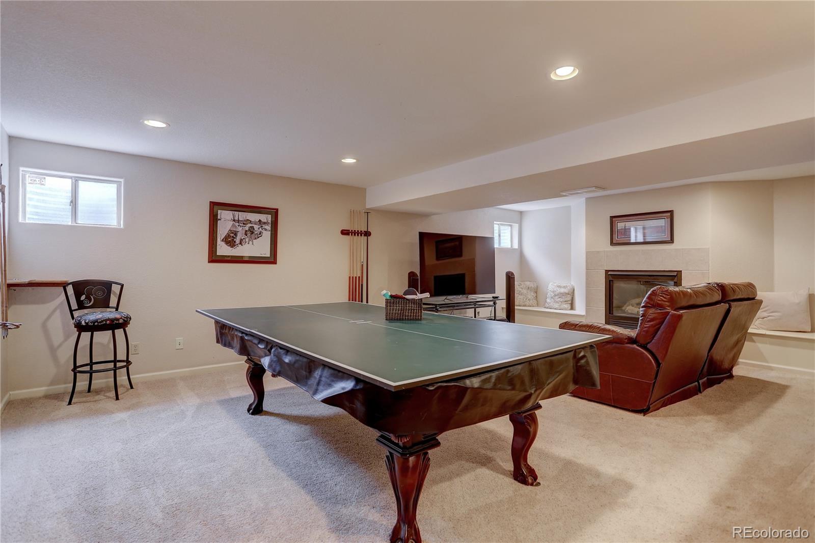 431 Mountain Chickadee Road Highlands Ranch, CO 80126 - Photo 28 of 38 a room with furniture pool table and a flat screen tv